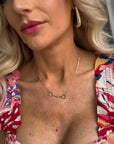 Dainty snaffle bit necklace with an equestrian-inspired pendant, available in gold or silver.