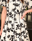 Floral puff sleeve mini dress styled for feminine boutique fashion