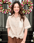 Woman wearing the Everyday Linen Elastic Waist Shorts featuring breathable linen-blend fabric, a relaxed fit, and a comfortable elastic waistband.
