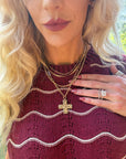 Hammered cross multi chain necklace with layered chains, available in gold or silver.