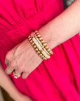 Luxe Pearl & Resin Bracelet Stack featuring layered stretch bracelets with pearls, white resin accents, and gold-tone beads.