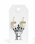 Elegant pearl drop earrings styled for boutique fashion