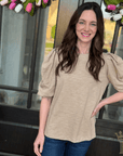 Feminine puff sleeve knit top styled for boutique fashion