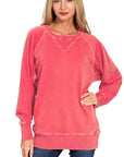 Front view of a dark red French terry pullover featuring a ribbed crewneck with V-shaped inset, long sleeves, and ribbed hem.