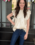 Woman wearing Vervet by Flying Monkey Motivated Crop Flare Jeans featuring comfort stretch denim, a high-rise waist, and a flattering cropped flare silhouette.