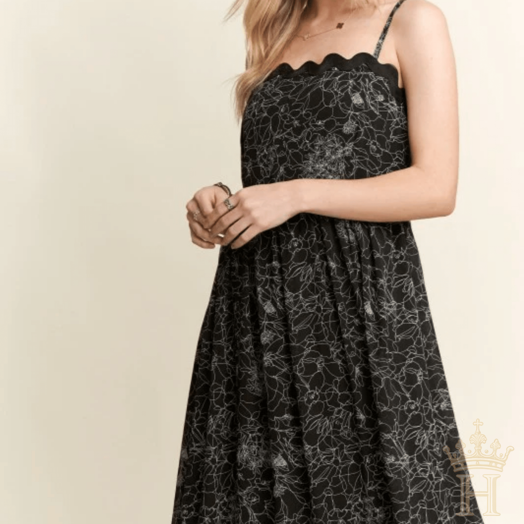 Front view of black floral scalloped tiered maxi dress with flowy silhouette