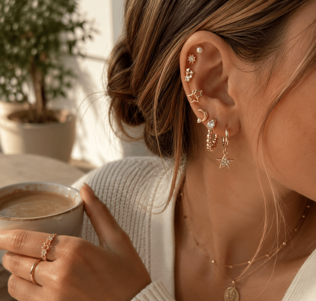Celestial Dreams 9-pair gold-tone earring set with stars, moons, pearls, crystal studs and huggie hoops.