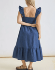 Woman wearing Country Charm ruffle strap midi dress from Halemi & Co.