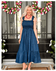 Feminine ruffle strap midi dress styled for boutique summer fashion