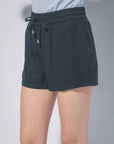 Black relaxed fit drawstring shorts styled for casual boutique fashion