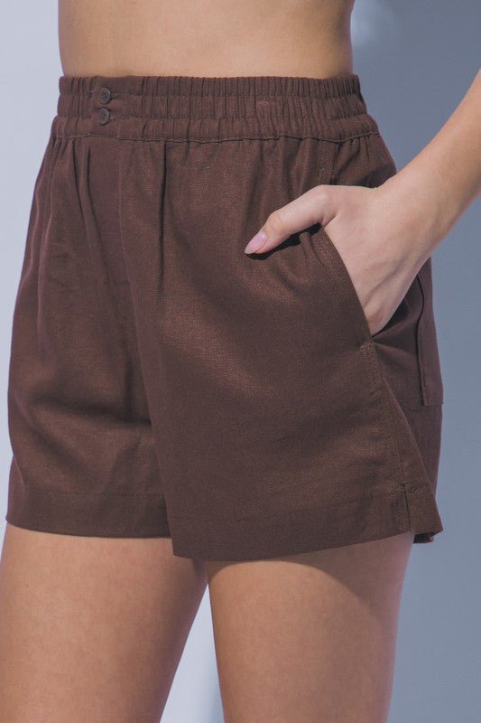 Lightweight brown linen boutique shorts with elastic waistband