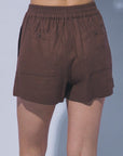Lightweight brown linen boutique shorts with elastic waistband back view