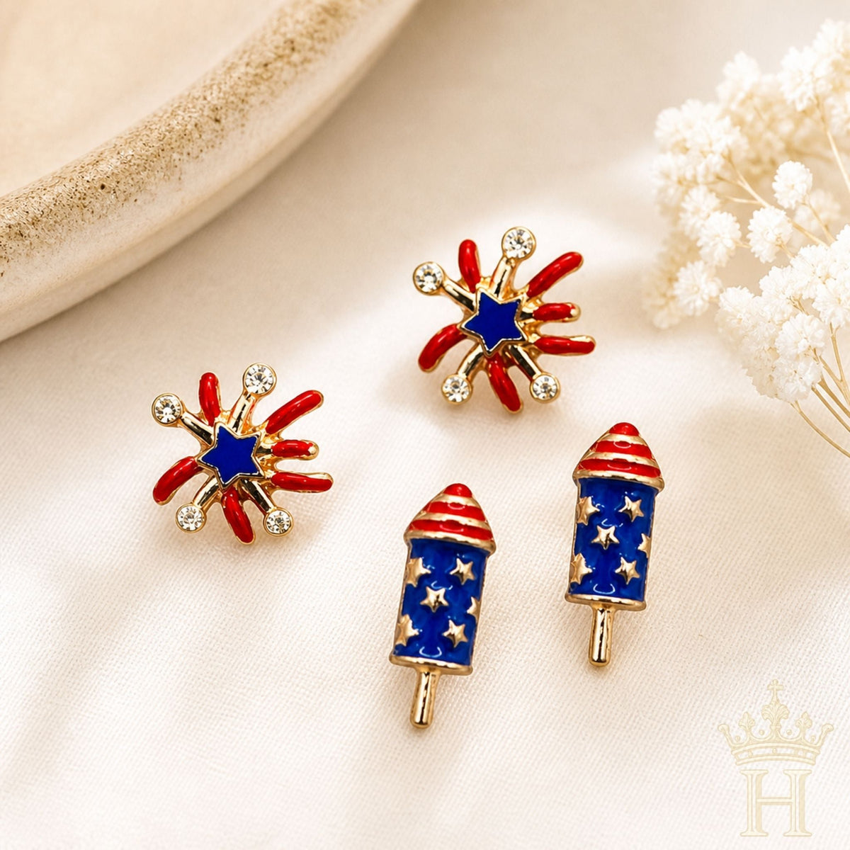 Fireworks & Firecracker Patriotic Stud Earring Set featuring multiple red, white, and blue stud earrings with festive Americana-inspired designs.