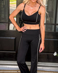 Woman wearing the Go Mode Contrast Trim Active Top featuring lightweight performance fabric, contrast trim details, and a flattering athletic fit.