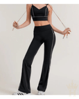 Black flare activewear pants with contrast piping detail