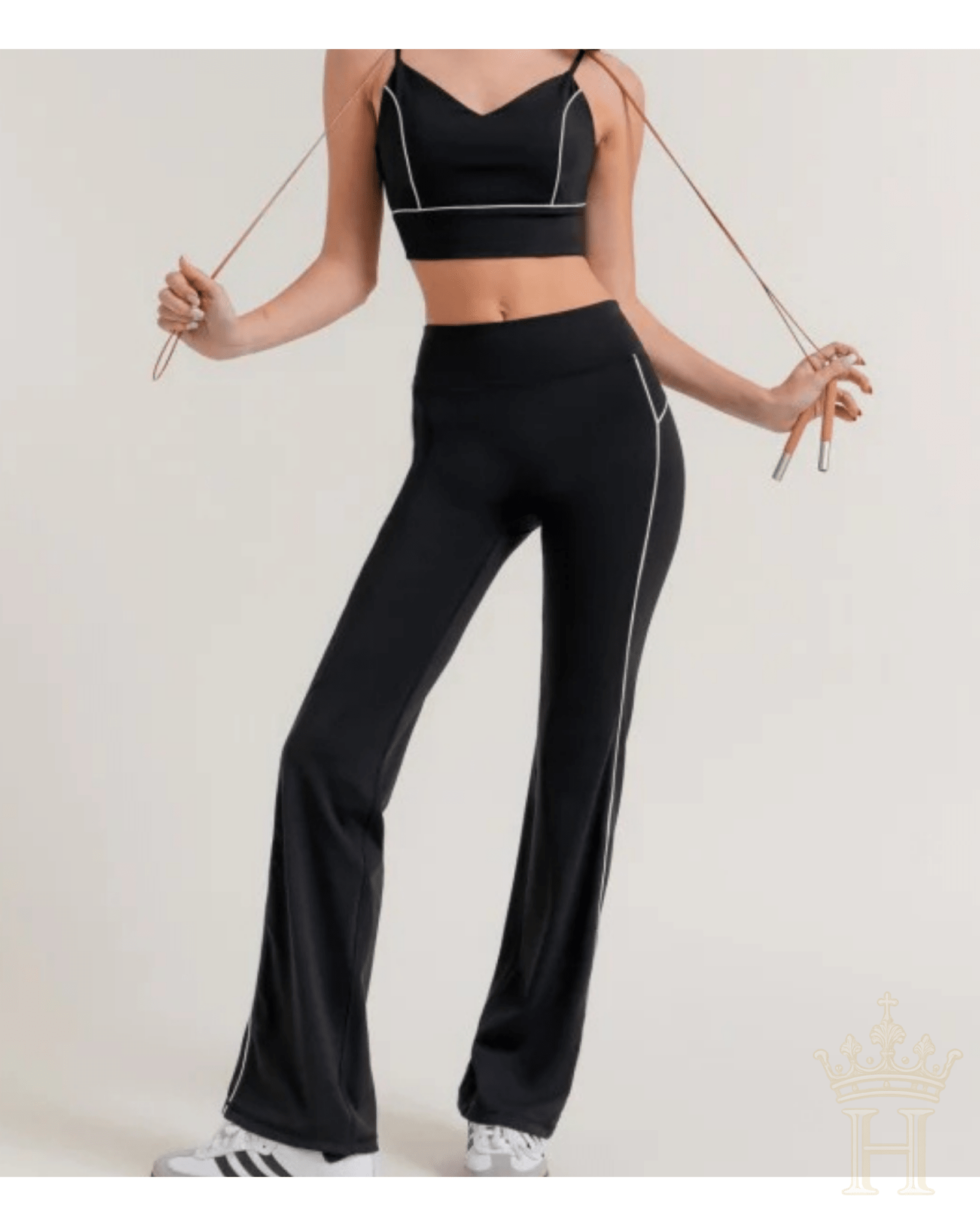 Black flare activewear pants with contrast piping detail
