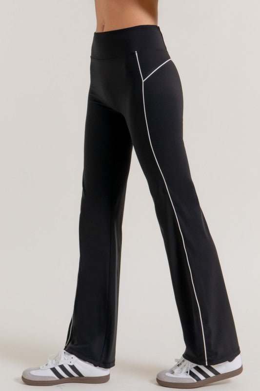 Side view of black contrast trim flare workout pants