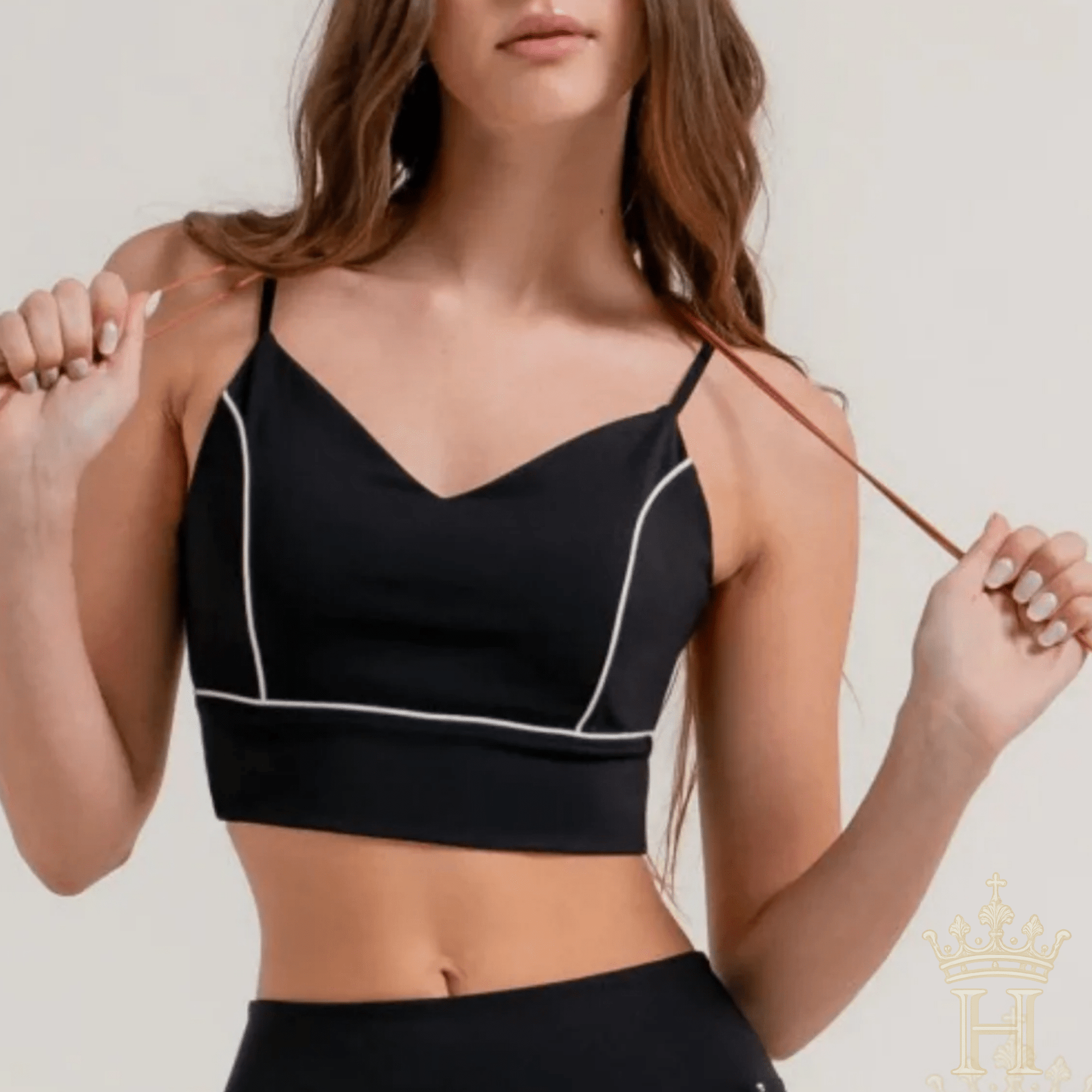 Black fitted workout top with contrast piping detail