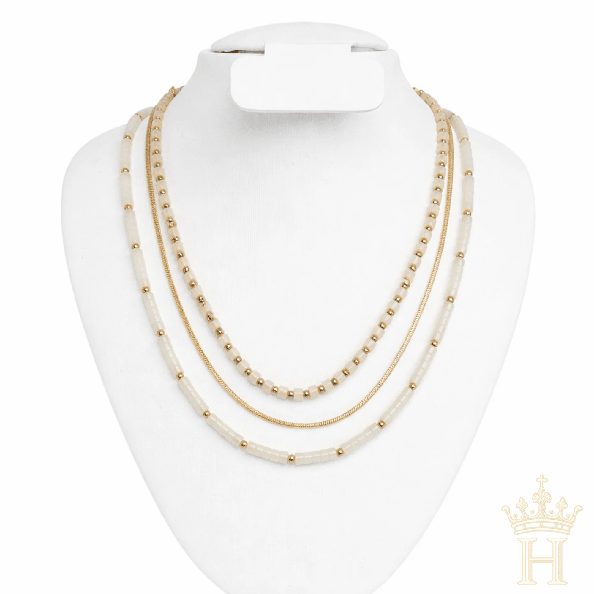 Trendy layered gold necklace with white bead detailing