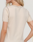 Feminine top with modern contrast trim detailing