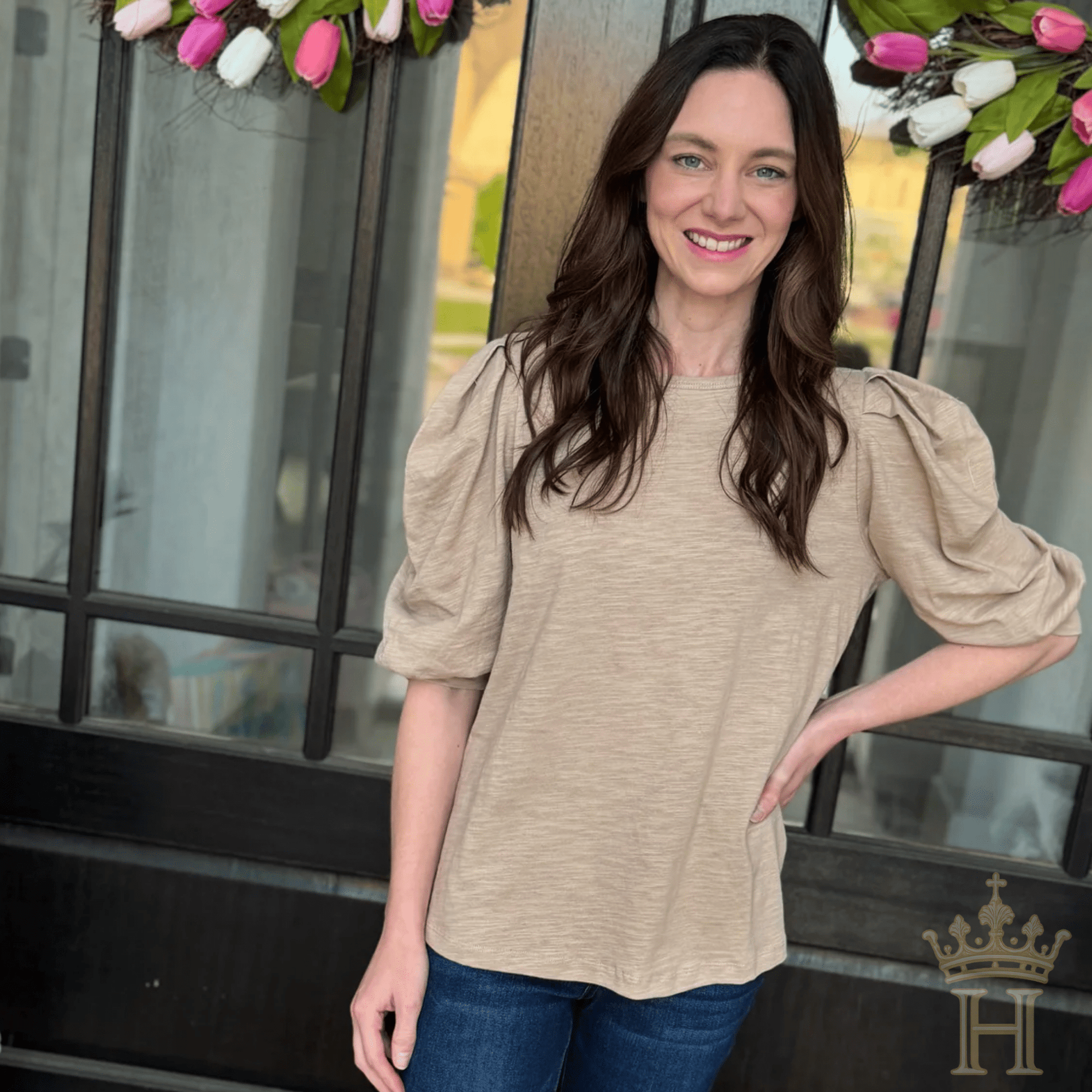 Feminine puff sleeve knit top styled for boutique fashion
