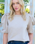 Woman wearing pleated puff sleeve knit top from Halemi & Co.