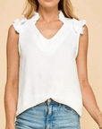 Off white flowy v-neck blouse with soft ruffle sleeves