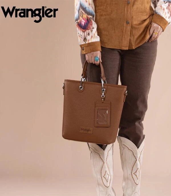 Woman carrying Wrangler brown convertible tote bag by the top handles