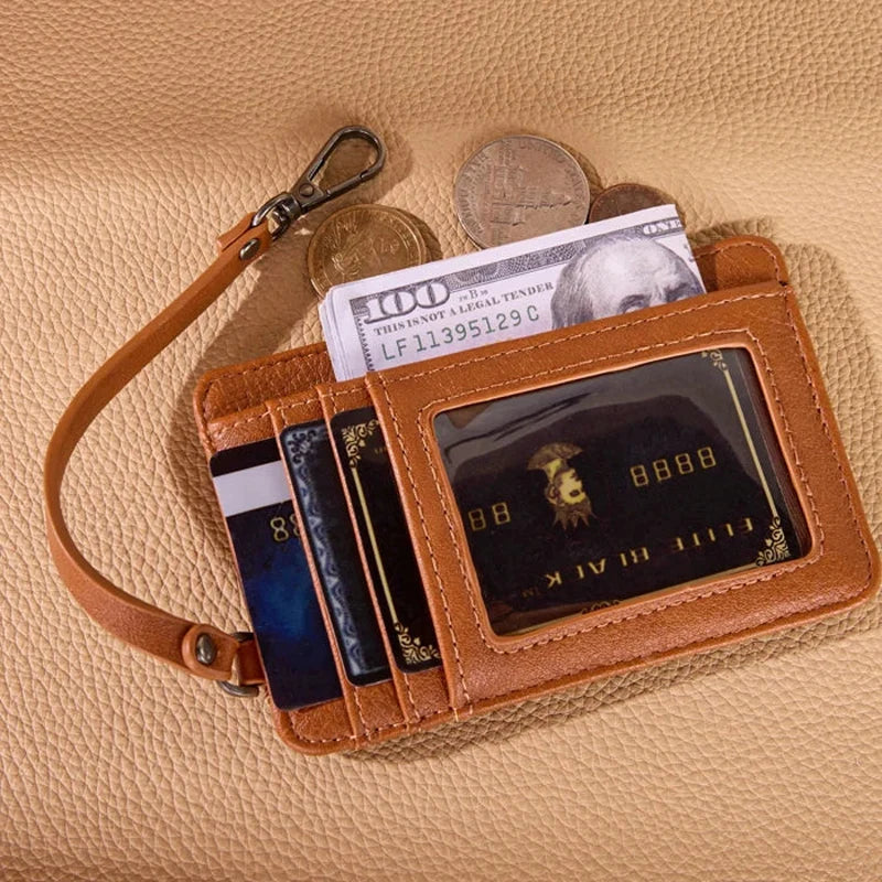 Brown leather wallet with cards, money, and coins on a beige surface